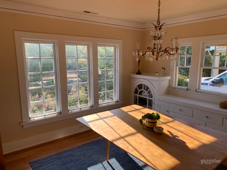  Dining room with cut glass chandelier and casement windows, built ins 