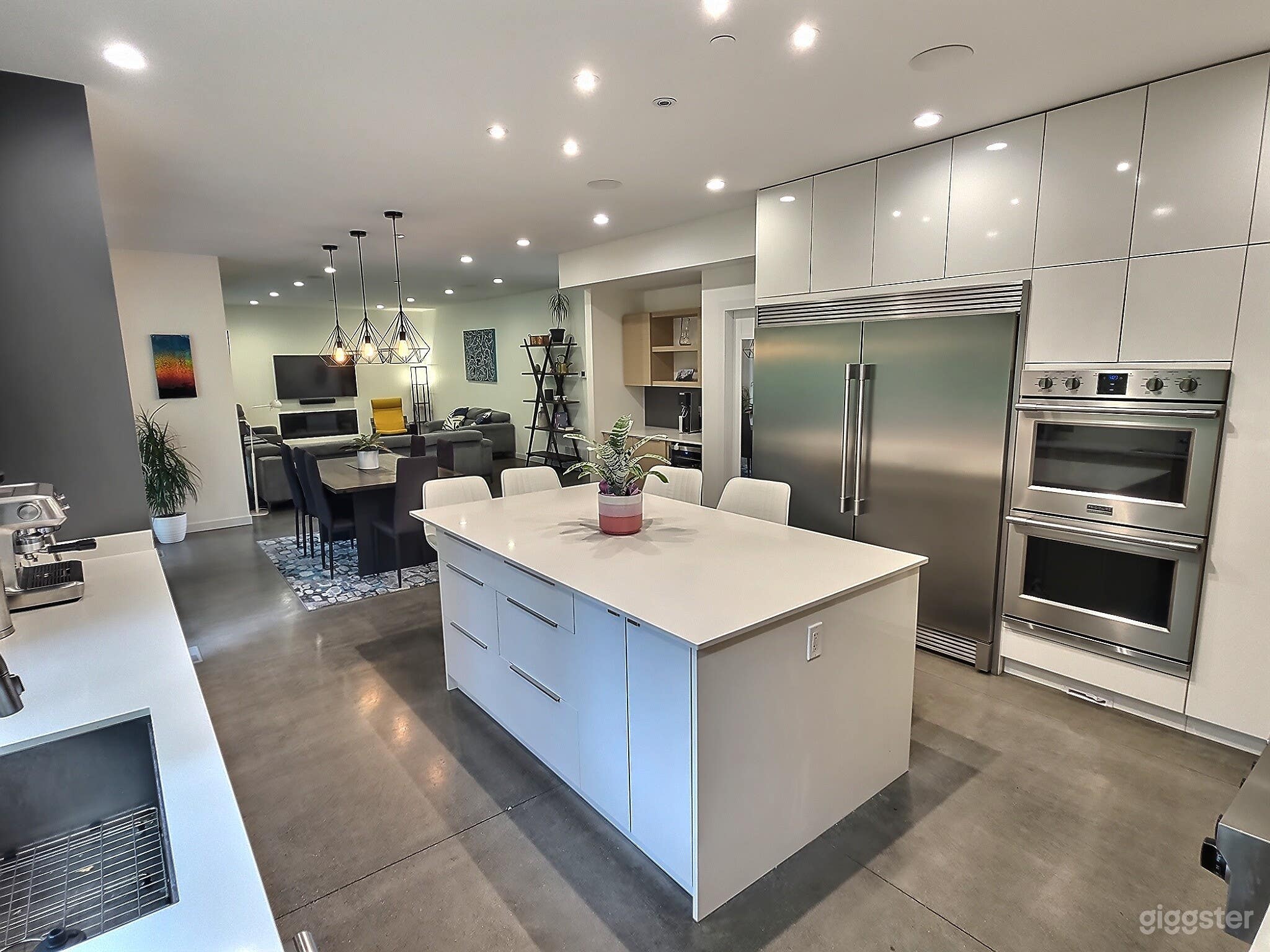 Chefs kitchen. Naturally bright, open plan kitchen with dual ovens,  commercial size fridge and freezer, 6 burner stove and large counter table and space to prepare your favorite meals.