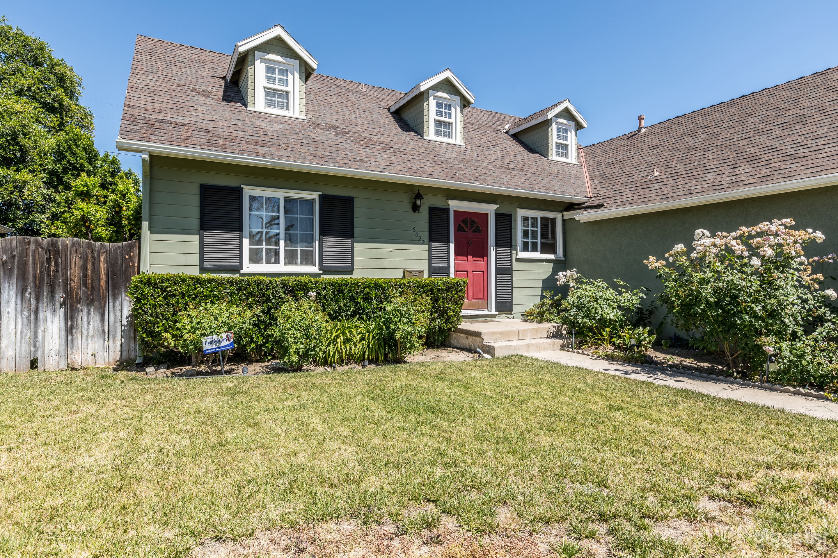 Cozy Wood-Paneled Cape Cod Style Home Photo 3