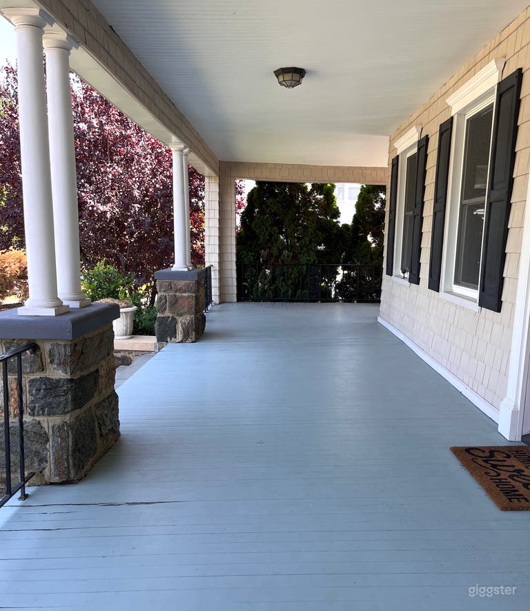  Front porch, this is the longer portion of the porch. The sitting area is around the corner on the right. That area faces the back yard.  