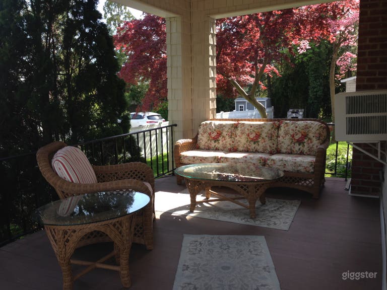  Side porch sitting area. Porch wraps around the side of the house to a private sitting area. 