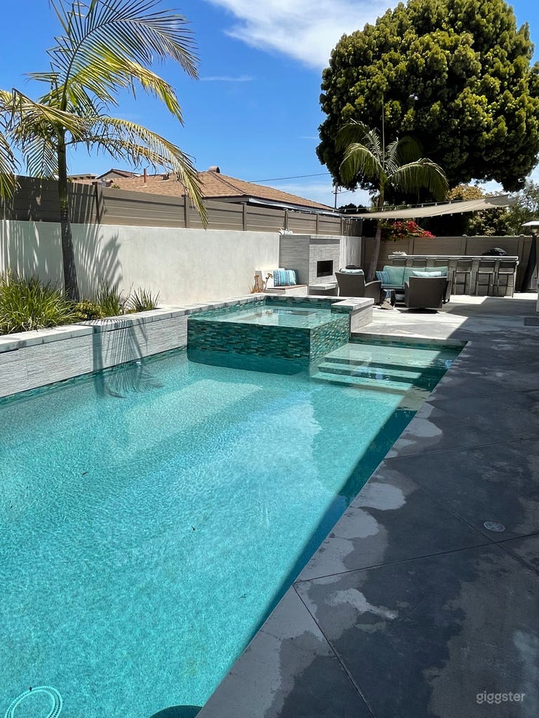  Pool and spa with water feature and LED color lights.
Fireplace and large BBQ area. 