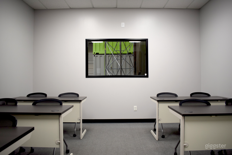  Our 12 person capacity classroom. Now featuring a small TV above the window for the presenters view of your slideshow. 