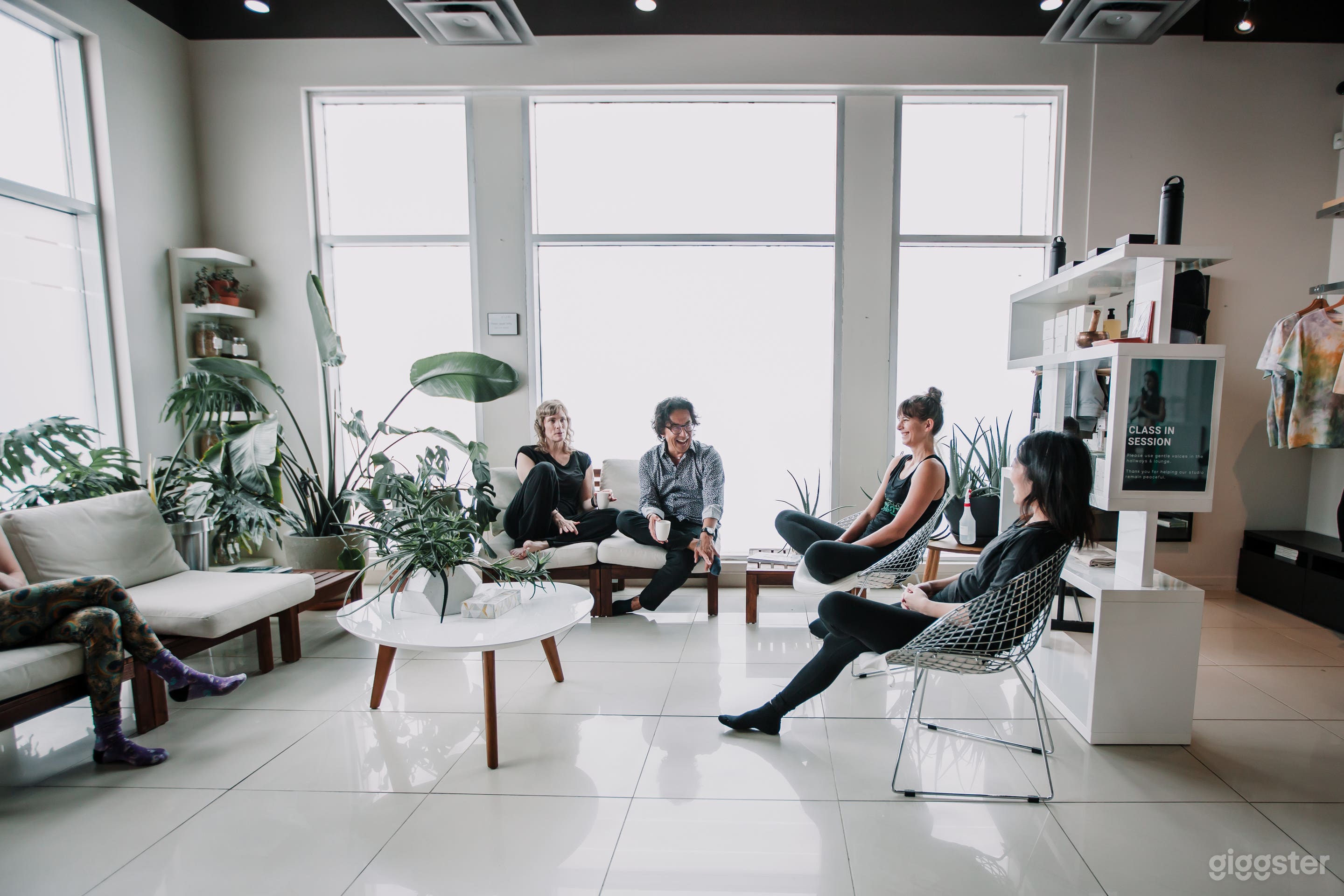 A bright and inviting lounge area with natural light, modern seating, and a calming atmosphere—perfect for welcoming guests, networking, or relaxing before an event.