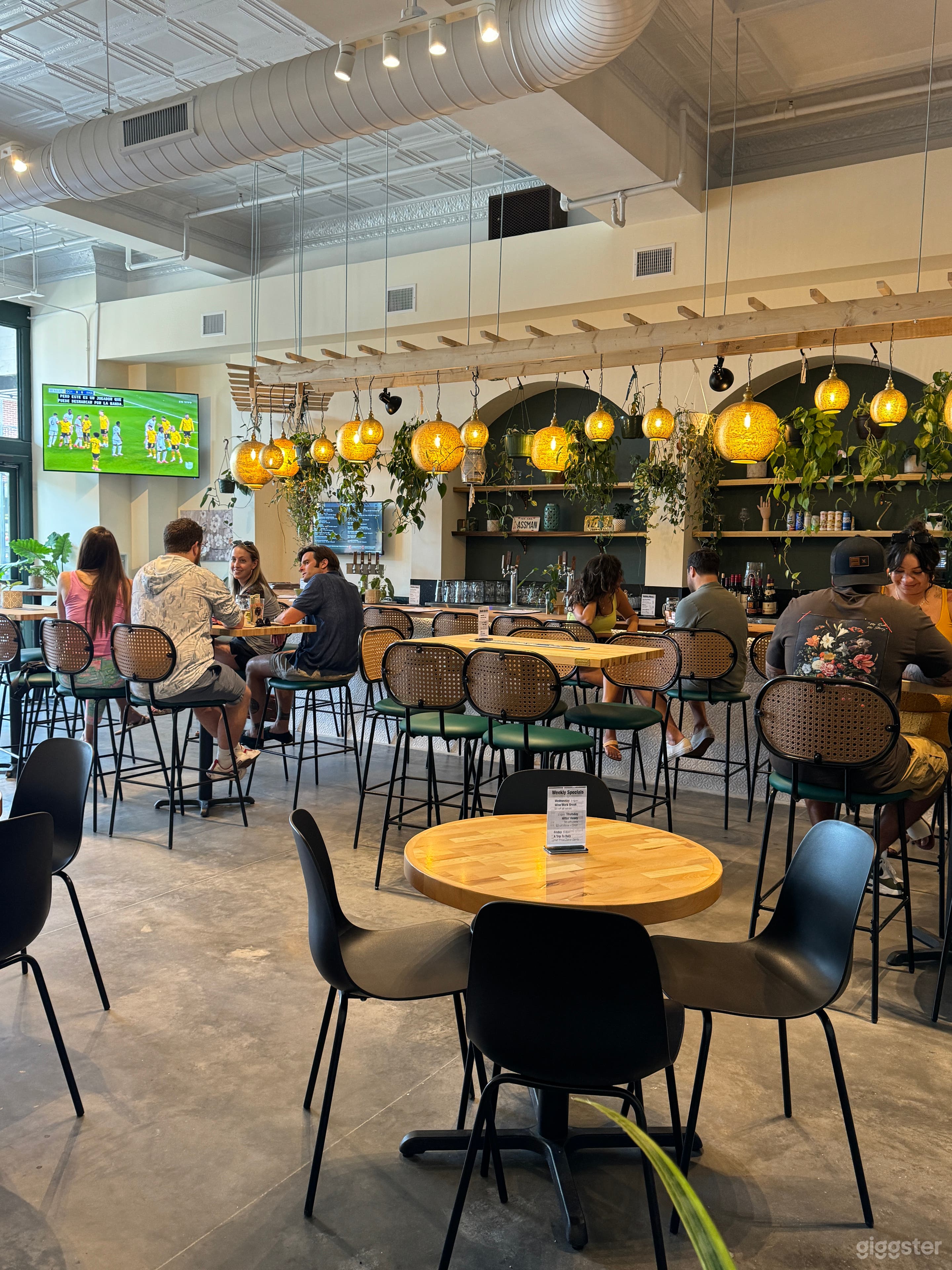 Bar shot looking towards the front of the building. Shows wood shelving inside arches