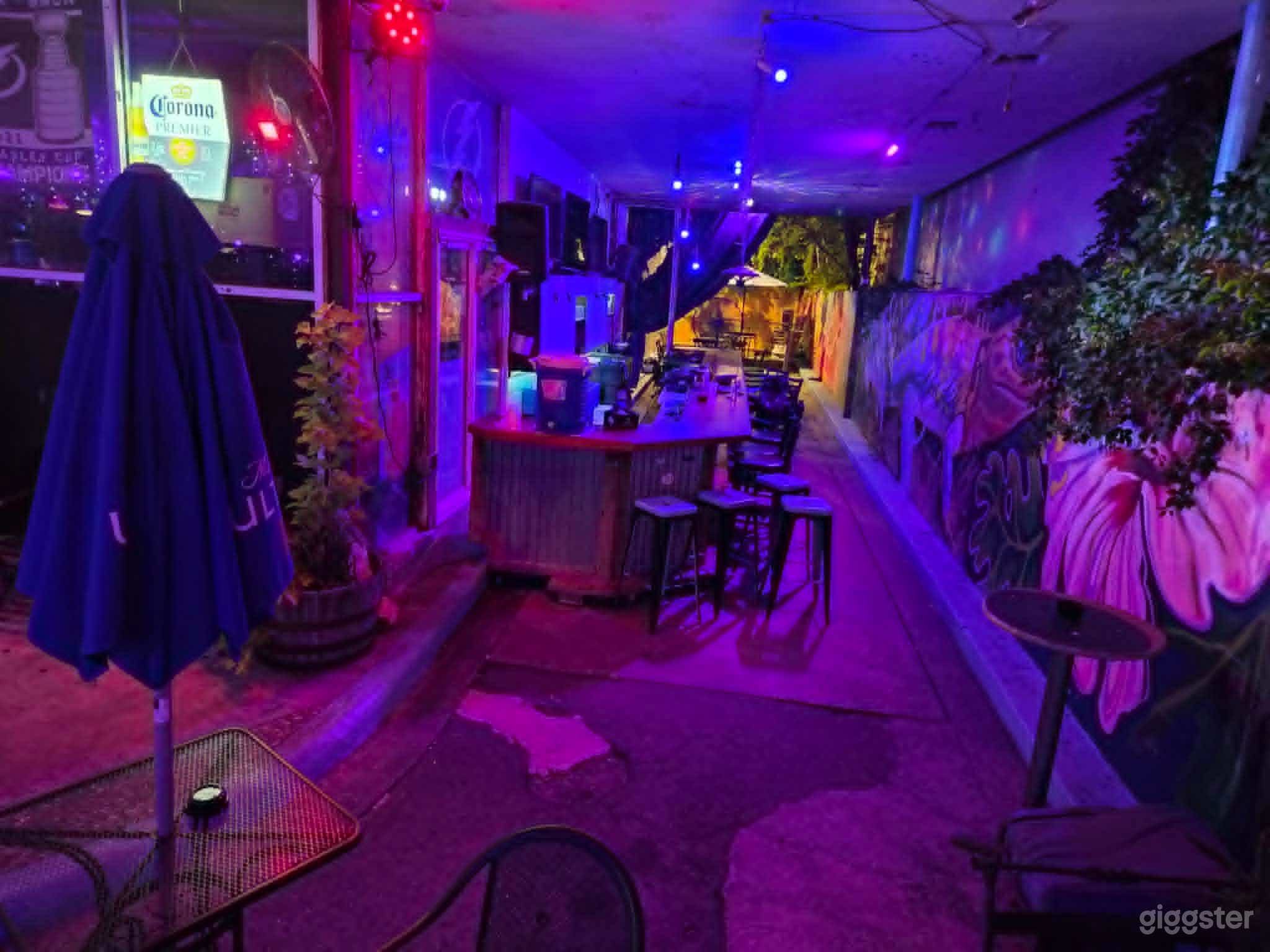 Vibrant Nightclub Event Venue with DJ Stage, Bar, Chic Patio Photo 4