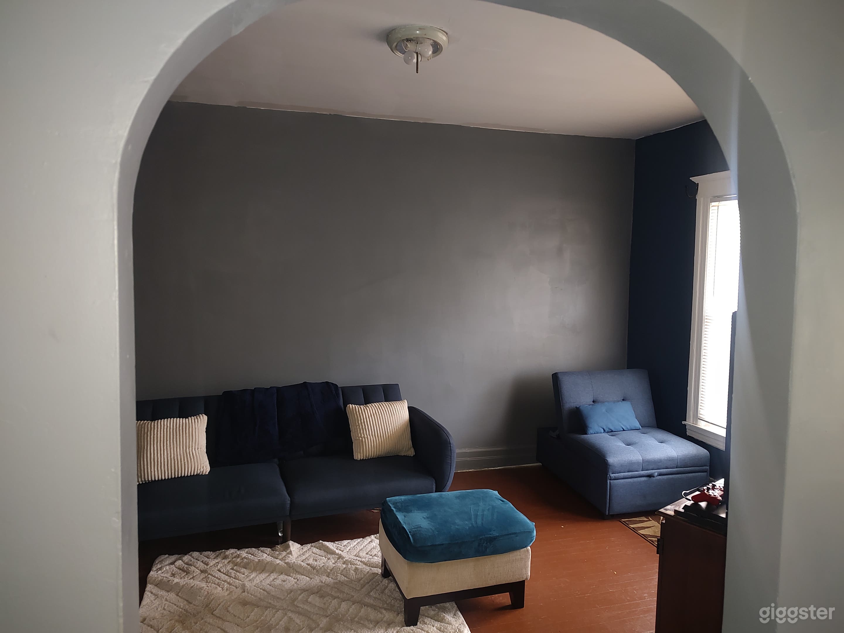 Open space with textured furniture and rugs. Inviting and private