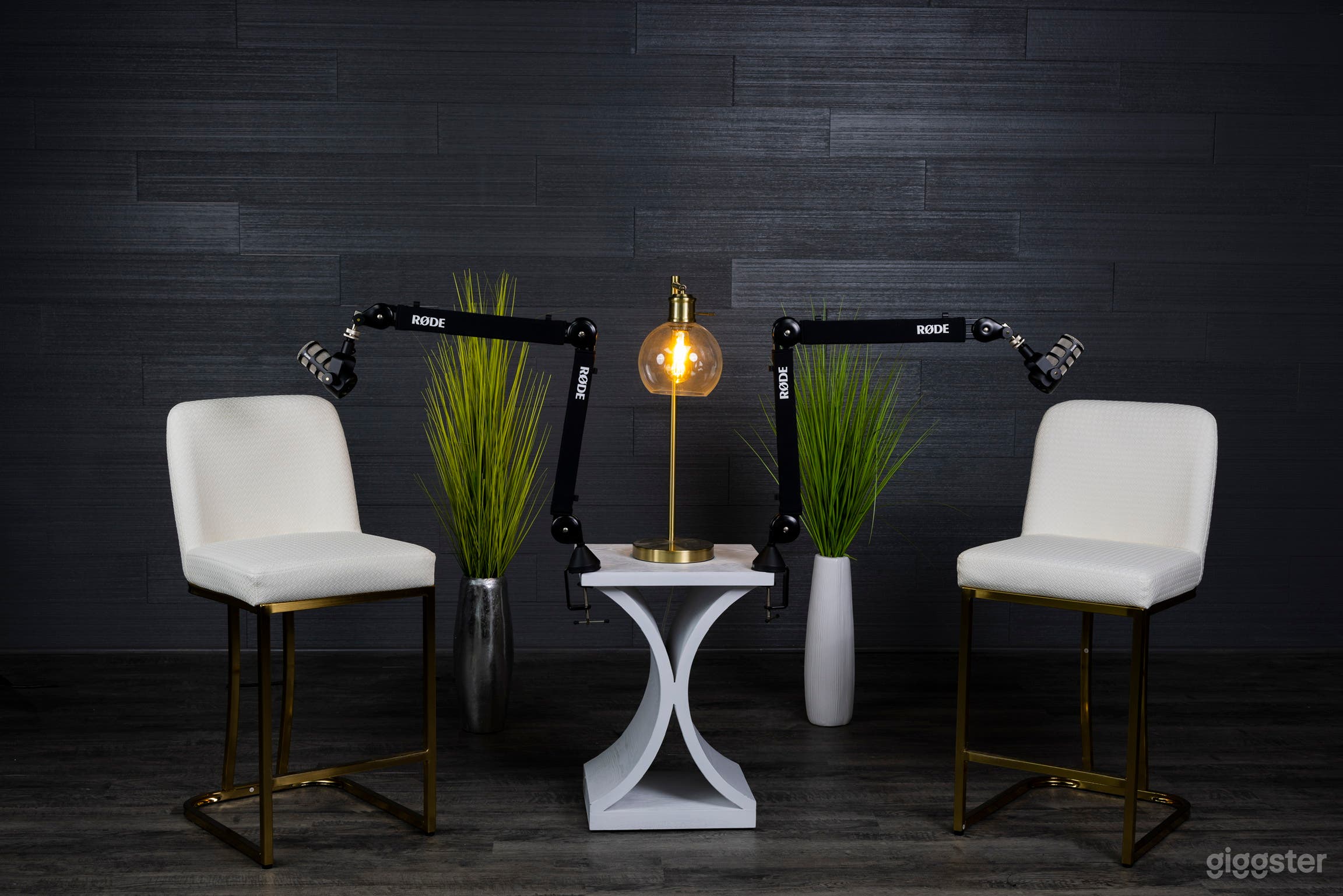 Dark grey shiplap backdrop. The studio also comes with 12 chairs/stools, 10 plant options of different heights and styles, 6 different side tables and 7 lamps of unique styles and color schemes.