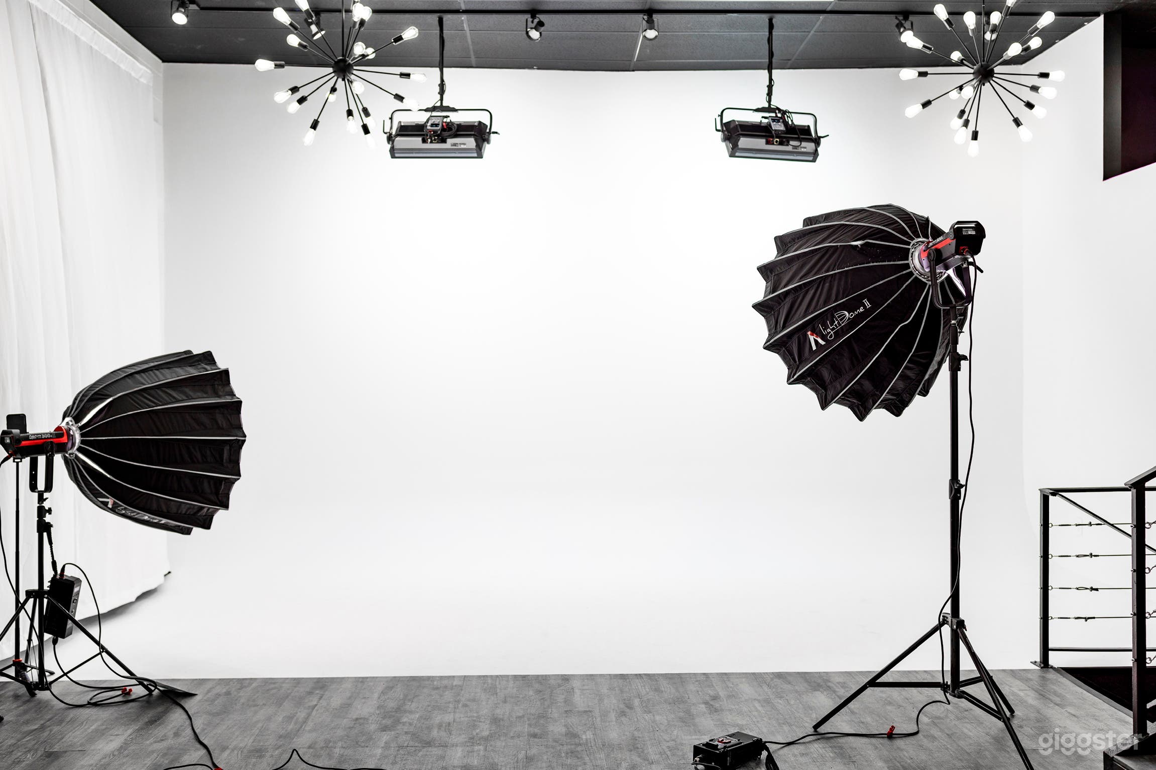 23 foot wide by 13 foot high cyclorama (cyc) wall with two Aputure Nova P600 lights mounted on the ceiling to light the cyc wall bright white or any other color imaginable with powerful output. Renting our space also comes with four aperture 300D Mark II’s