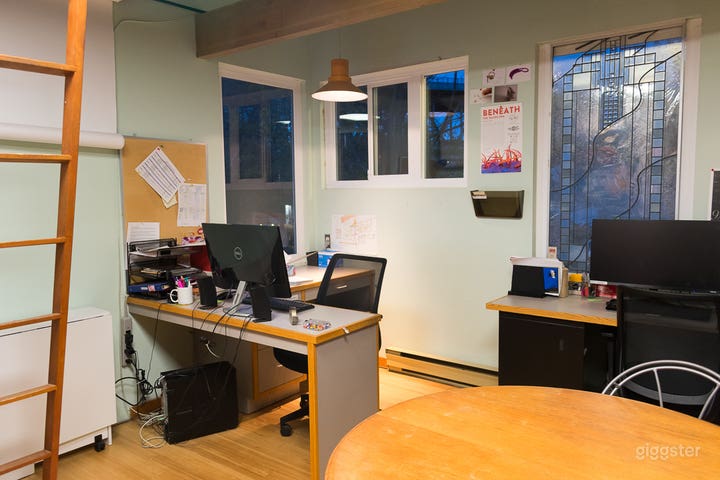 another view of the back office space with the ladder to the loft where files and art are stored
