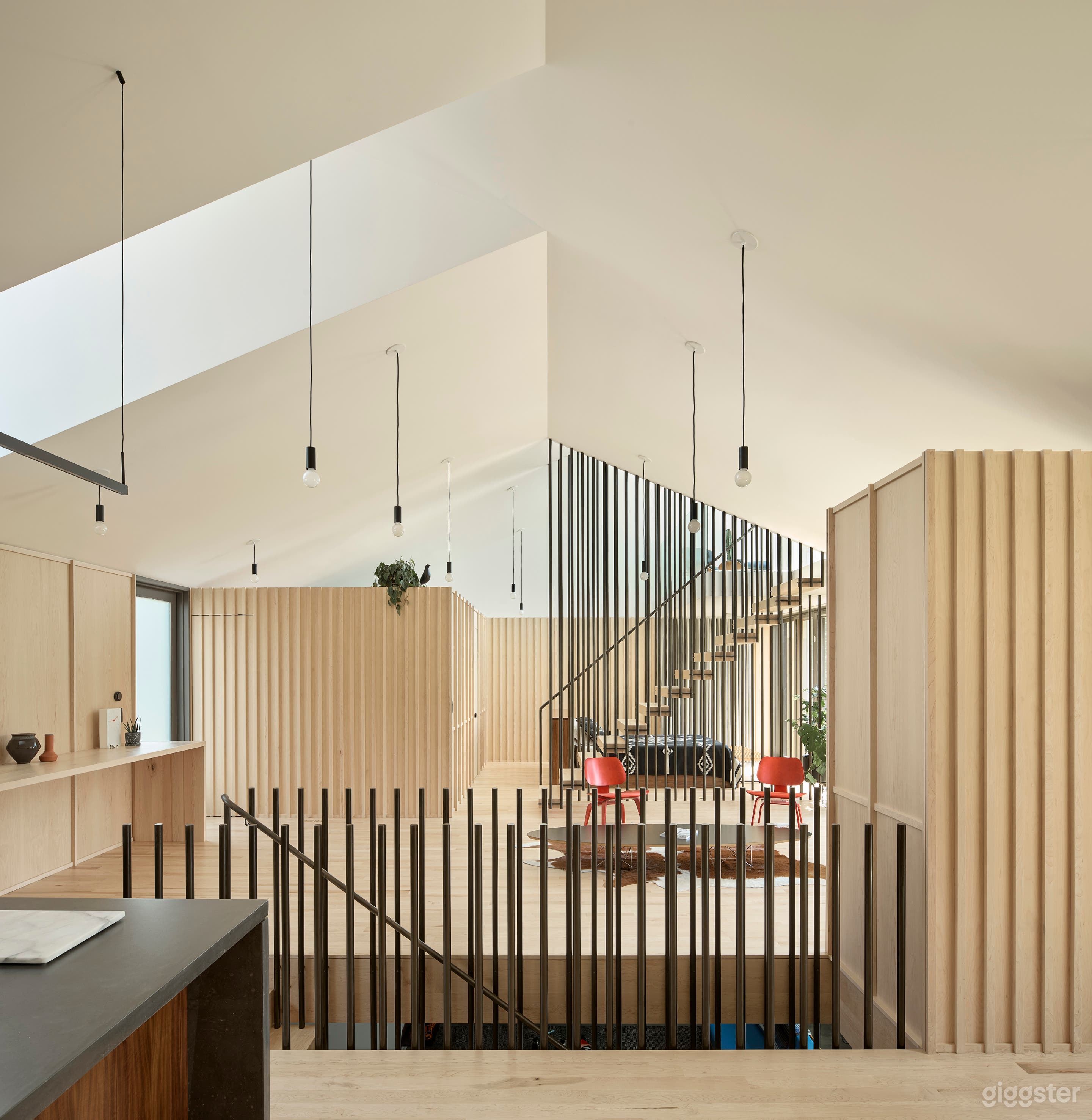 From the kitchen, looking towards the living space, bed, and loft
