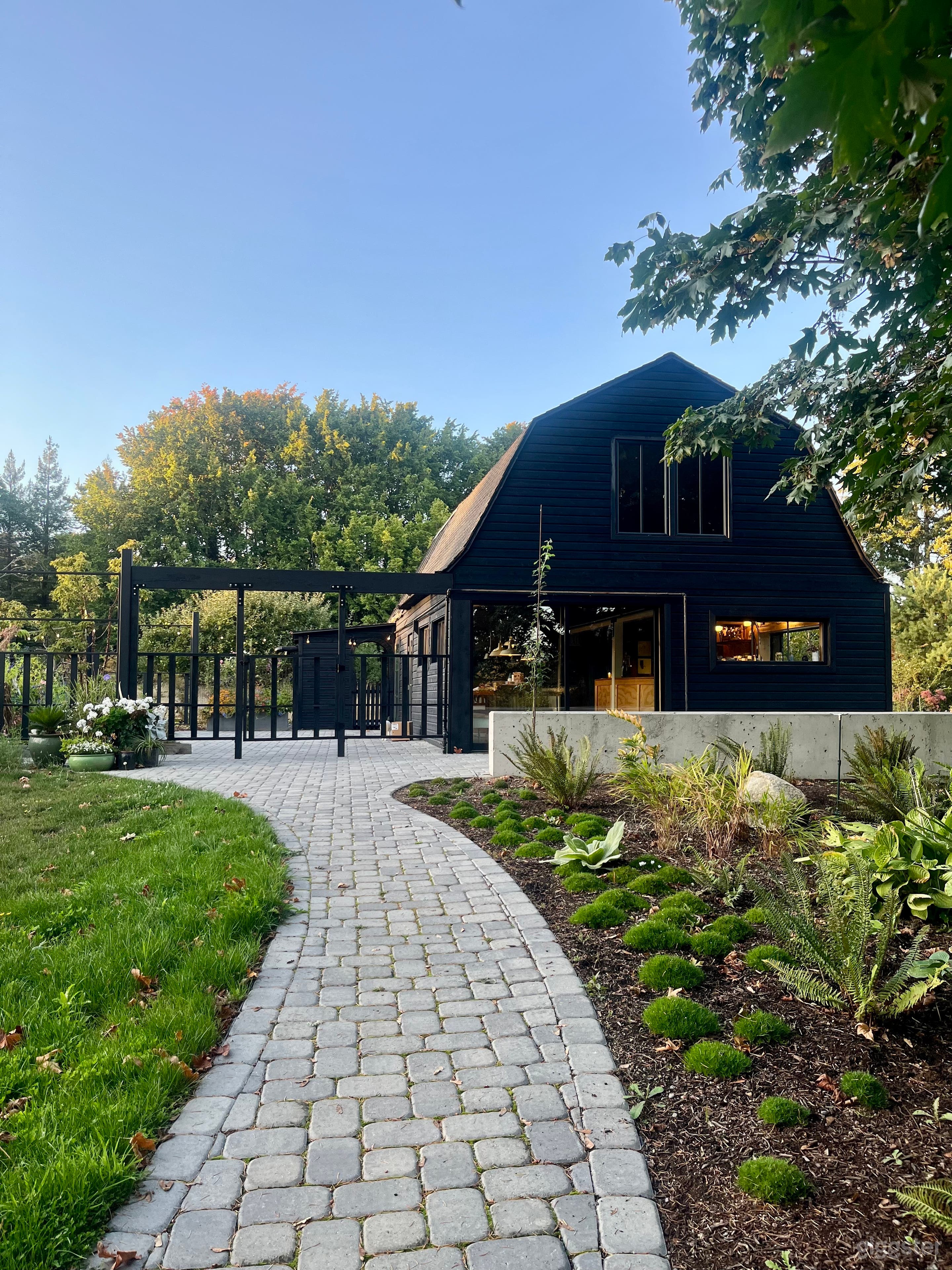 he primary accessible path from the parking area to the Barn. The wide, paved walkway ensures a smooth load-in for equipment carts, heavy gear, and event rentals.