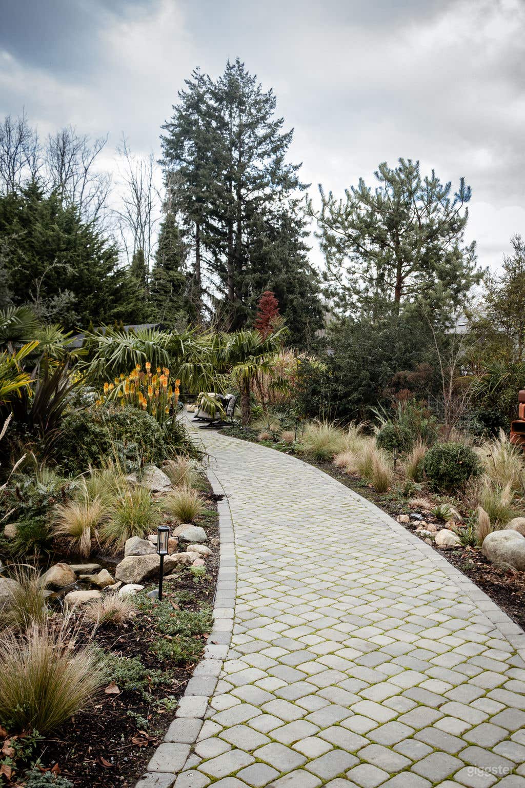 The scenic, landscaped path leading from the main Barn to the private sauna. A beautiful transition through the gardens that offers multiple angles for outdoor tracking shots.