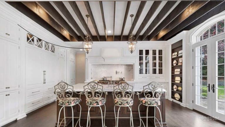  White kitchen with marble counter top  