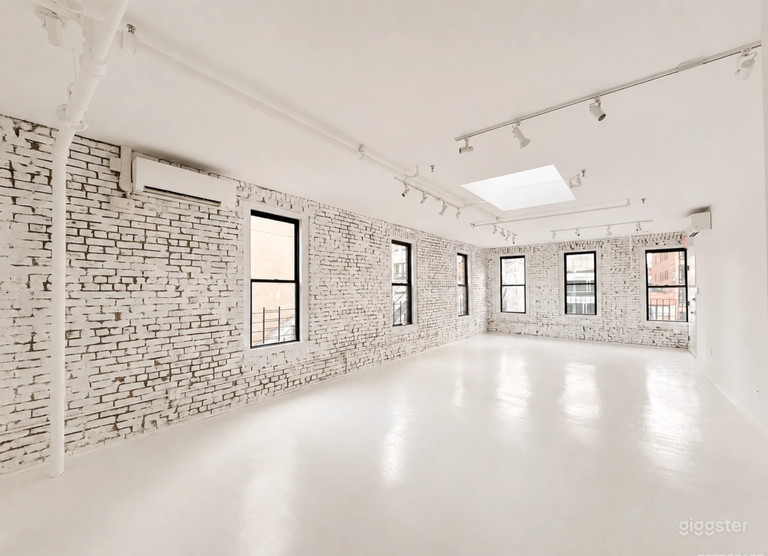  Artistic All-White Loft with Walls of Windows 