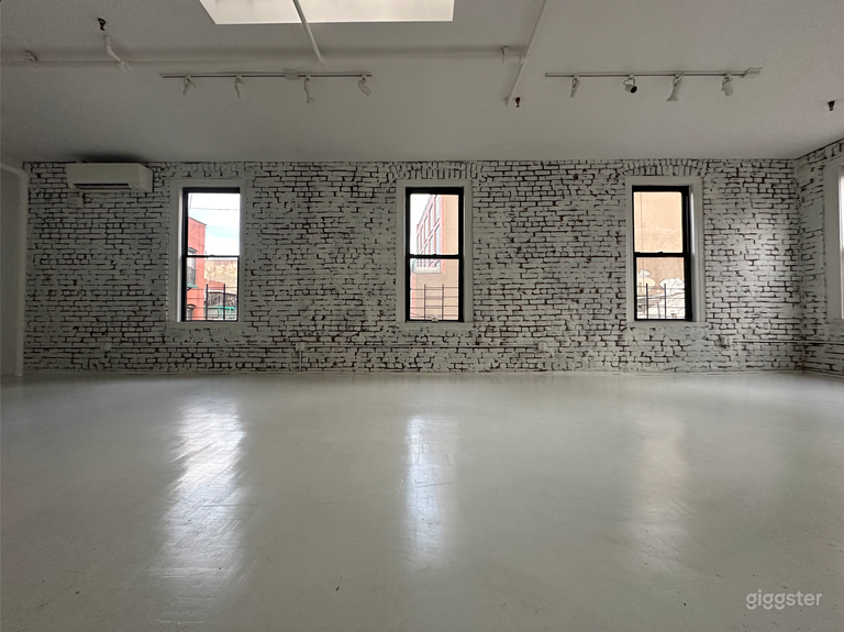  Artistic All-White Loft with Walls of Windows 