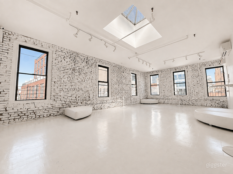  Artistic All-White Loft with Walls of Windows 