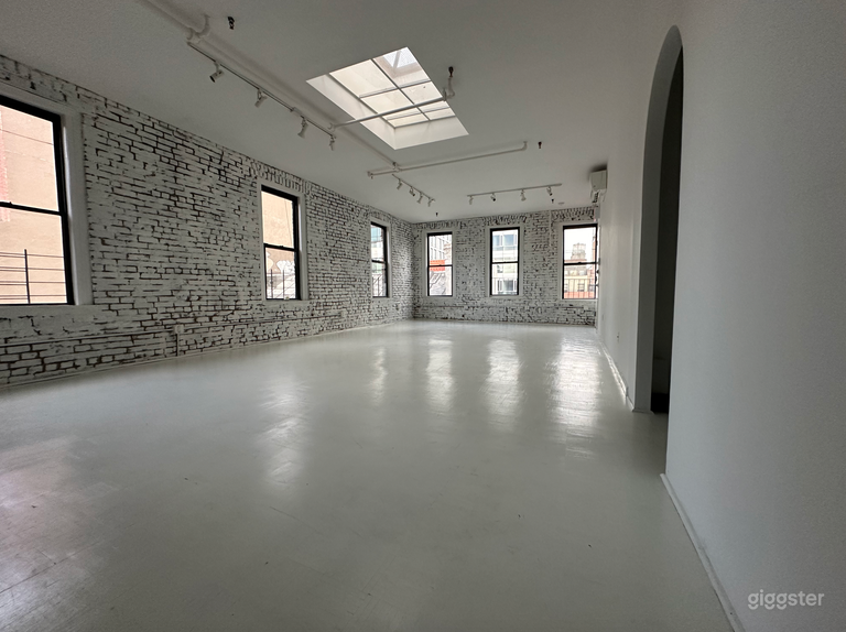  Artistic All-White Loft with Walls of Windows 