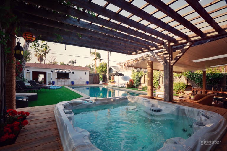  The Hot Tub! Surrounded by a deck with a built in Ice Bath, pergola with vines and purple flowers over the top 