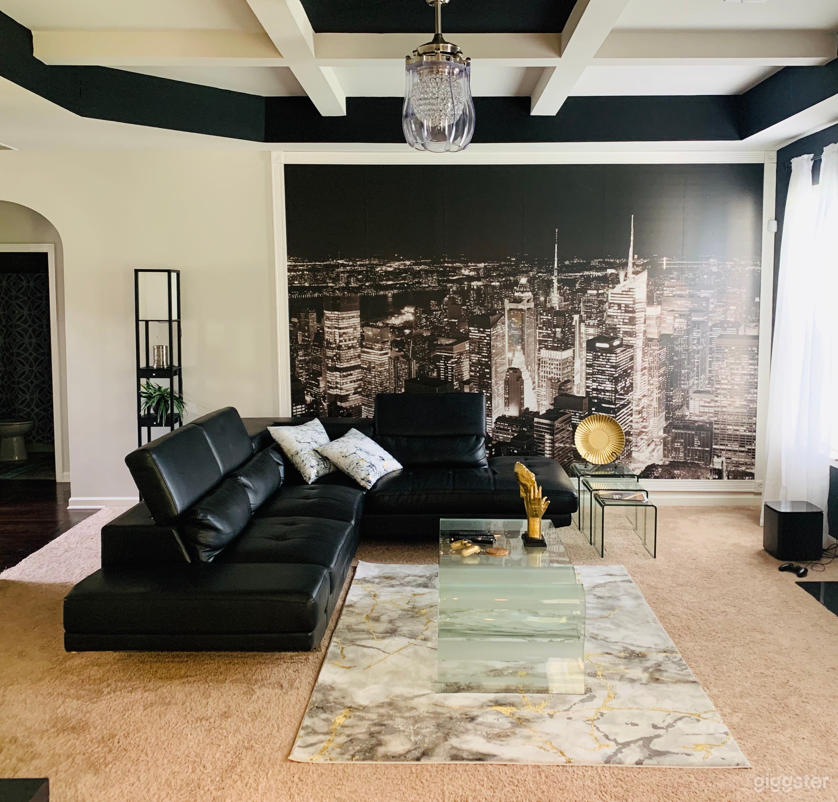 Family room also has coffered ceilings with electric fireplace. 