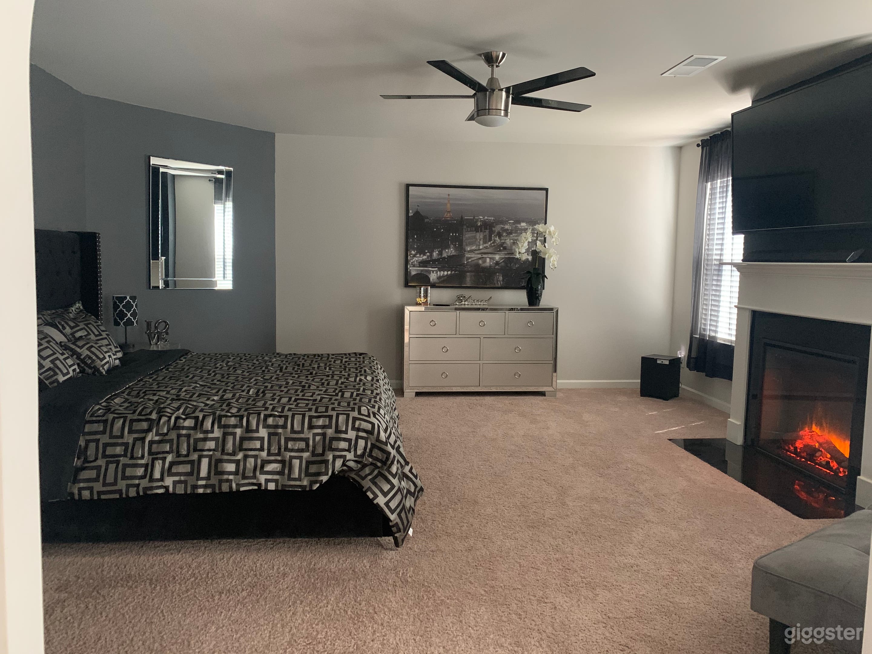 Master bedroom with electric fireplace 