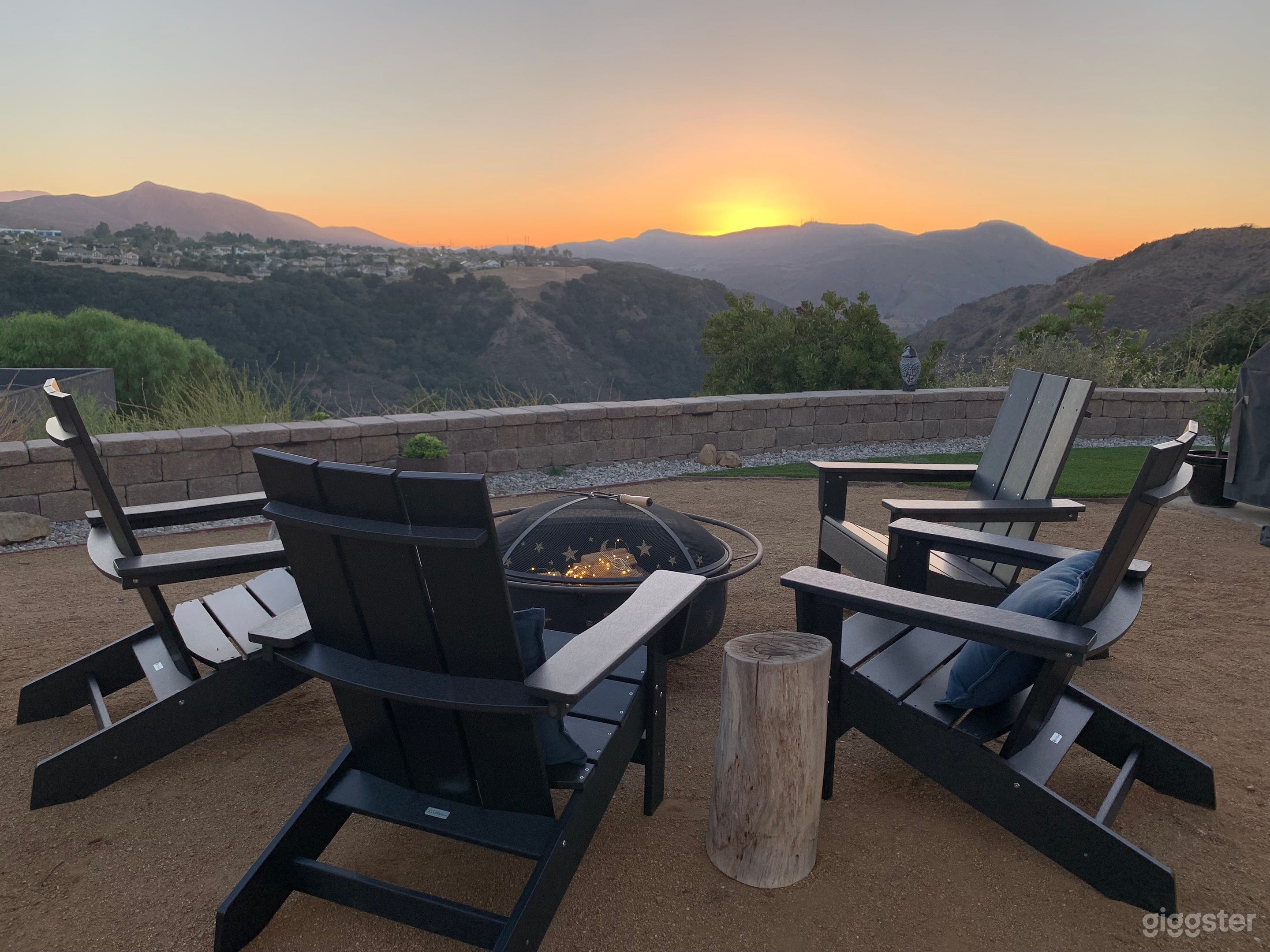 Sip on your glass of wine at this rustic fire pit set-up with fairy string lights as the sun drops below the Santa Monica mountain horizon.  Awesome spot for creative photographers!