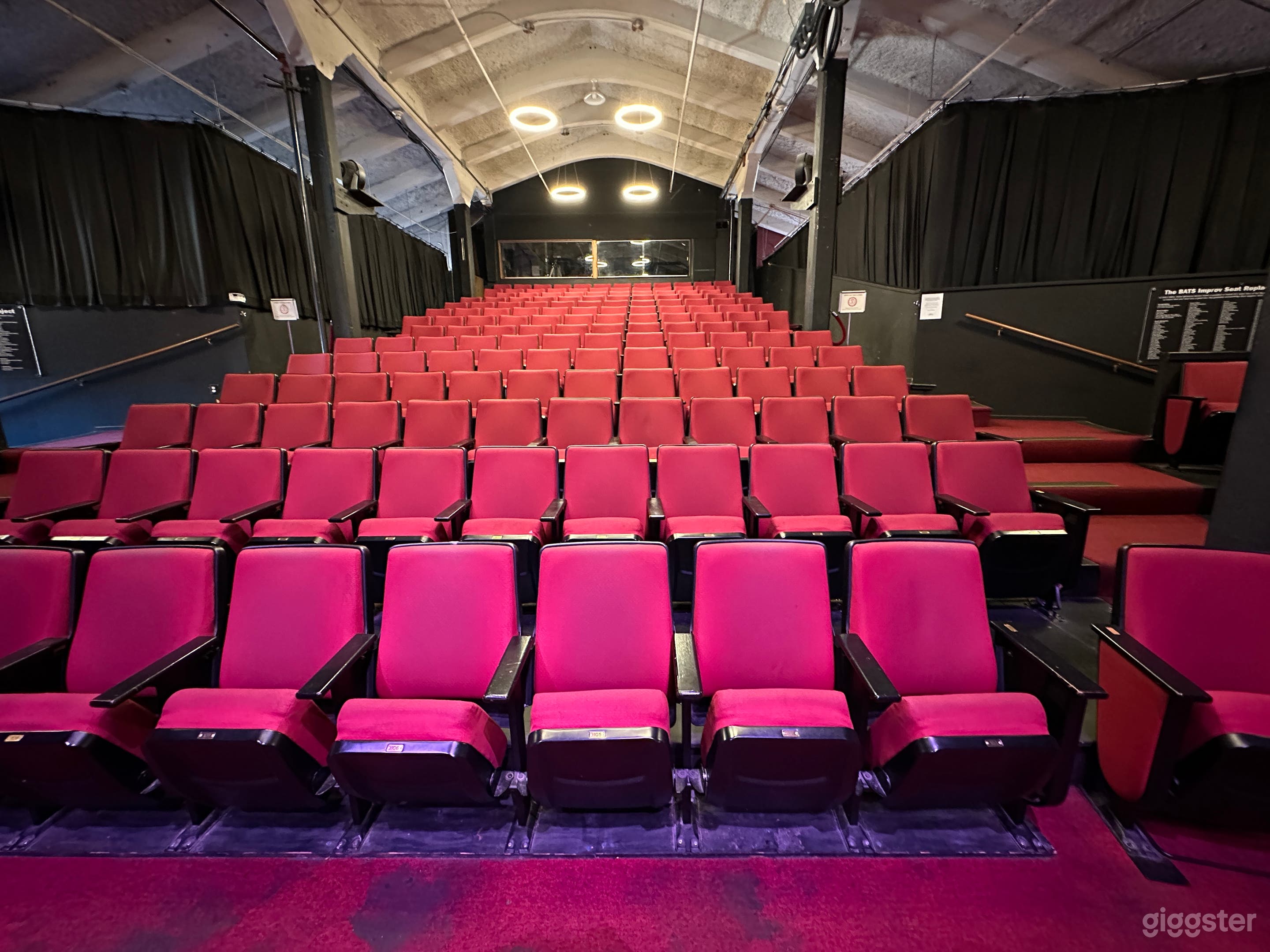 Bright airy theater has cross breeze with easy and west facing windows and new lighting grid.