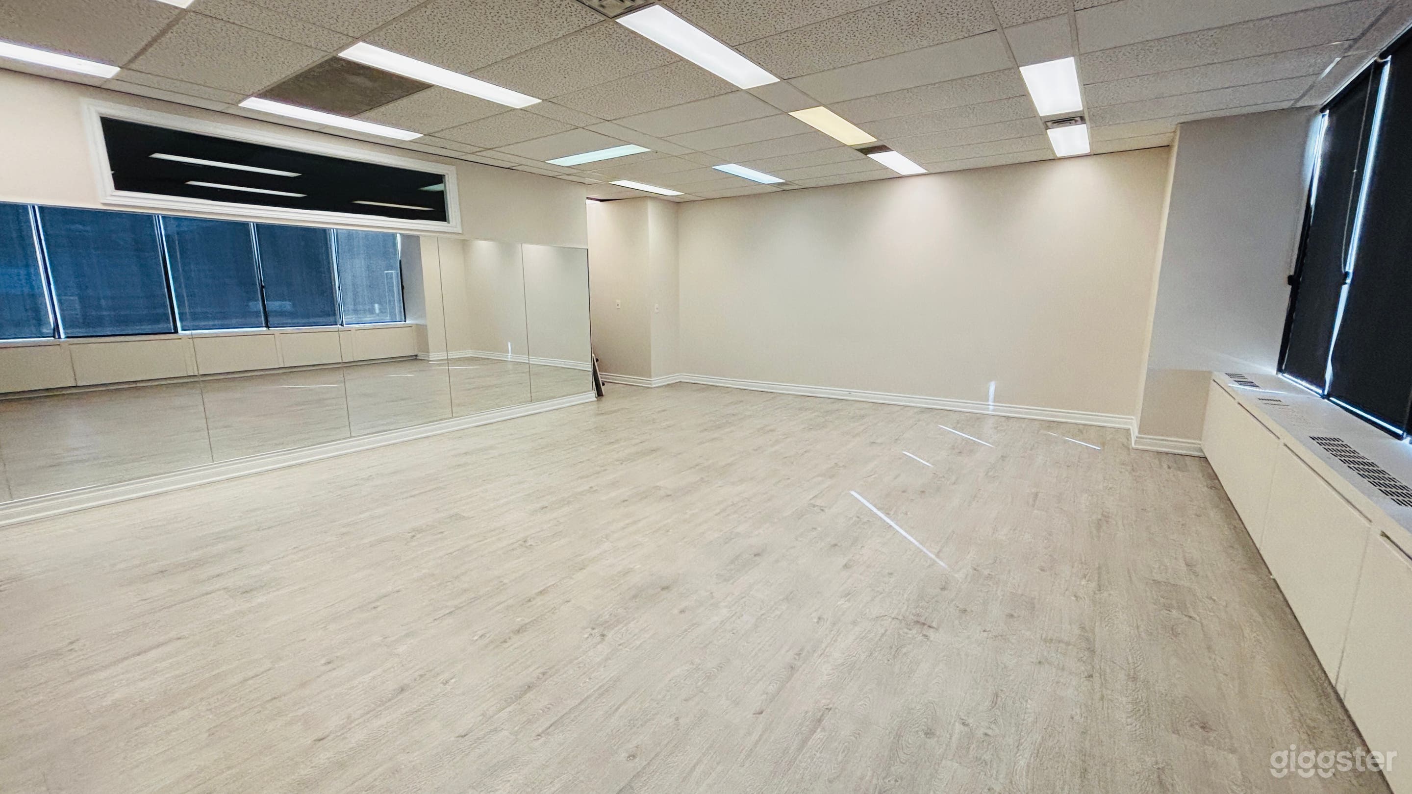 Dance room with mirrored walls and hard floor