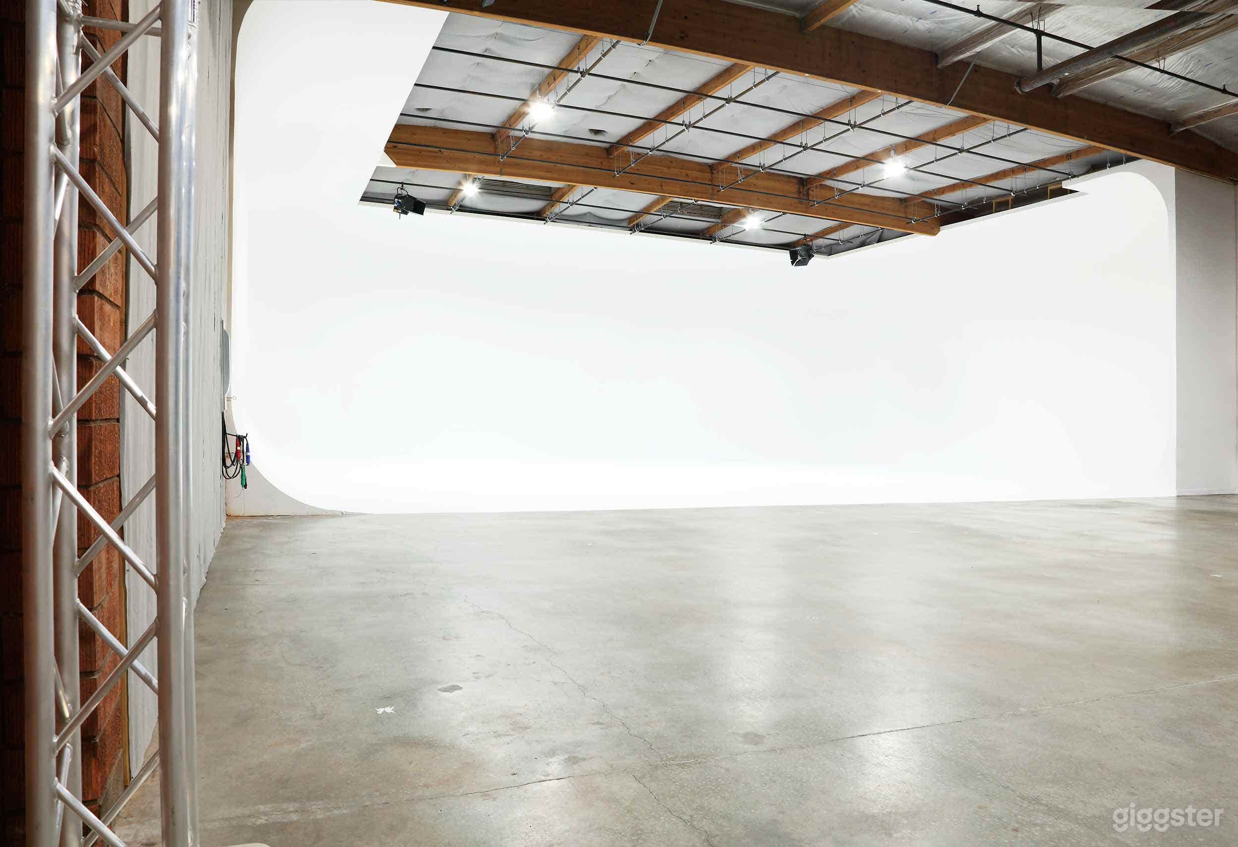 Huge 3 wall full cove cyclorama soundstage with grid. 70' wide 60' deep.