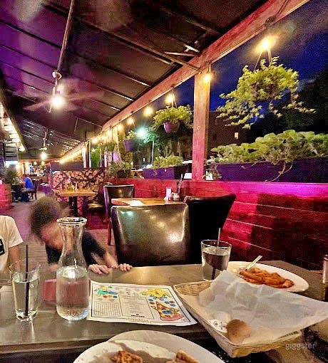 Covered Outdoor Patio in Modern Restaurant Photo 3