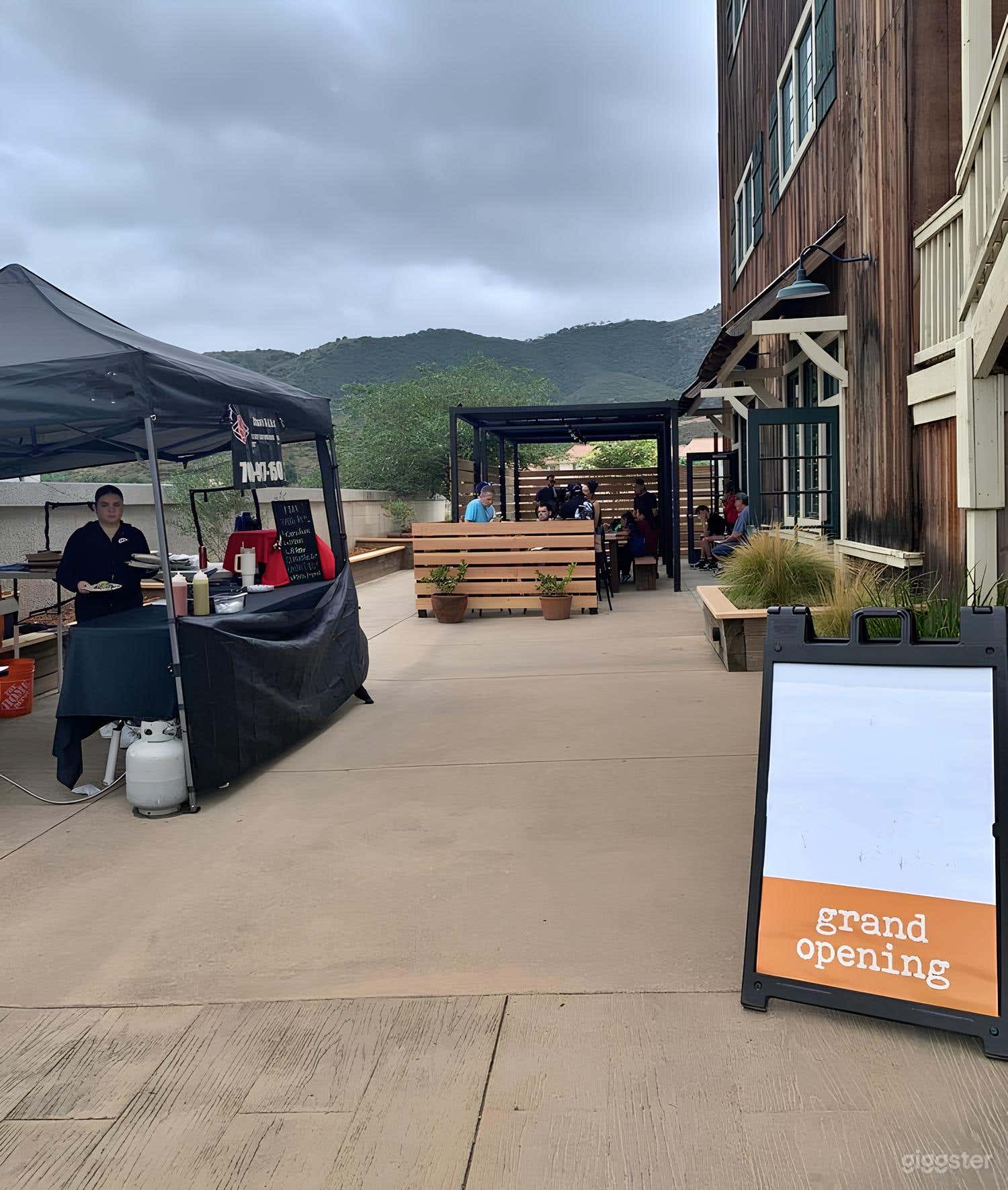 Sun-lit Patio with Party Benches Photo 1
