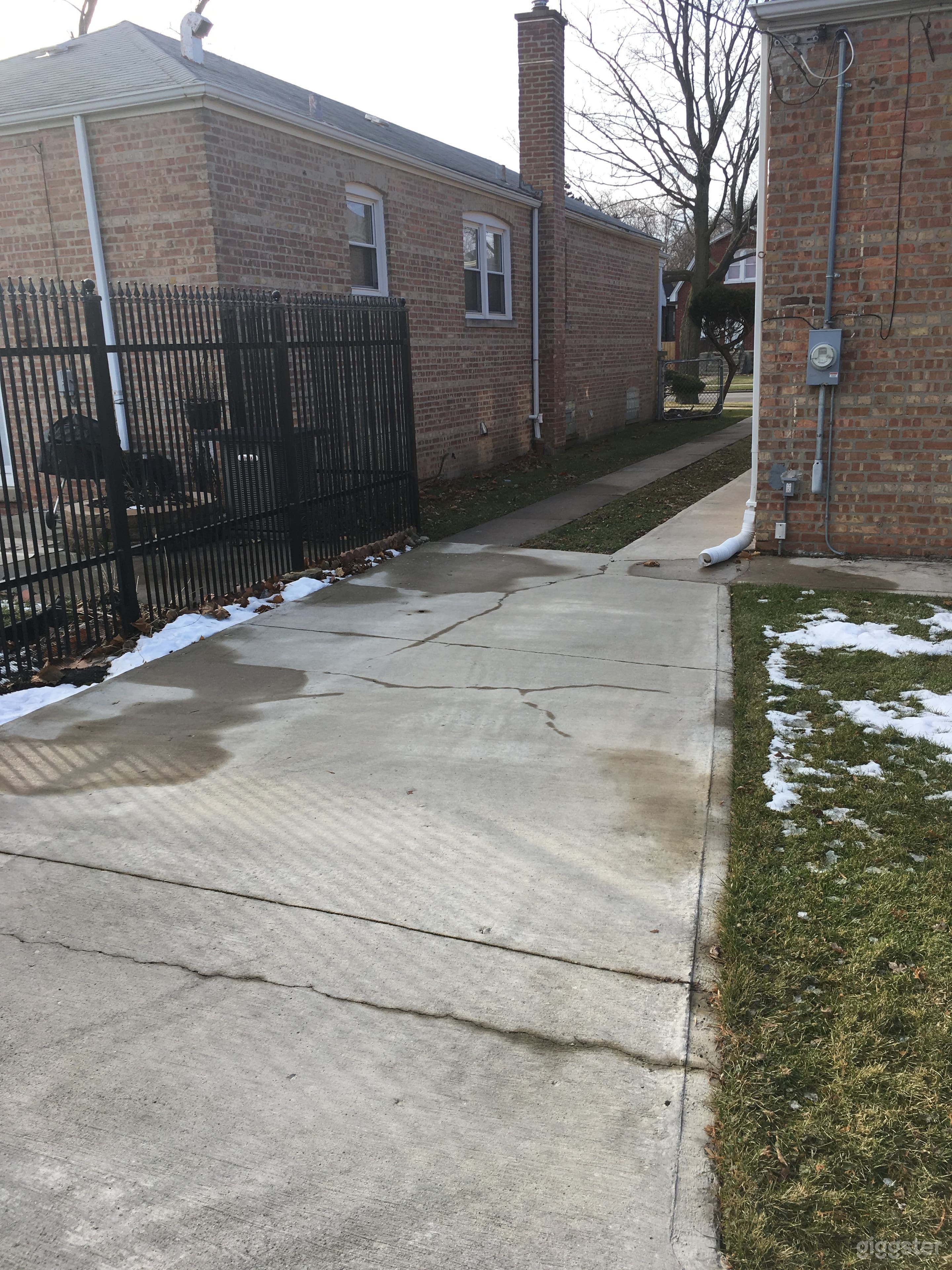 Driveway that extends the length of the property, plus carport pad