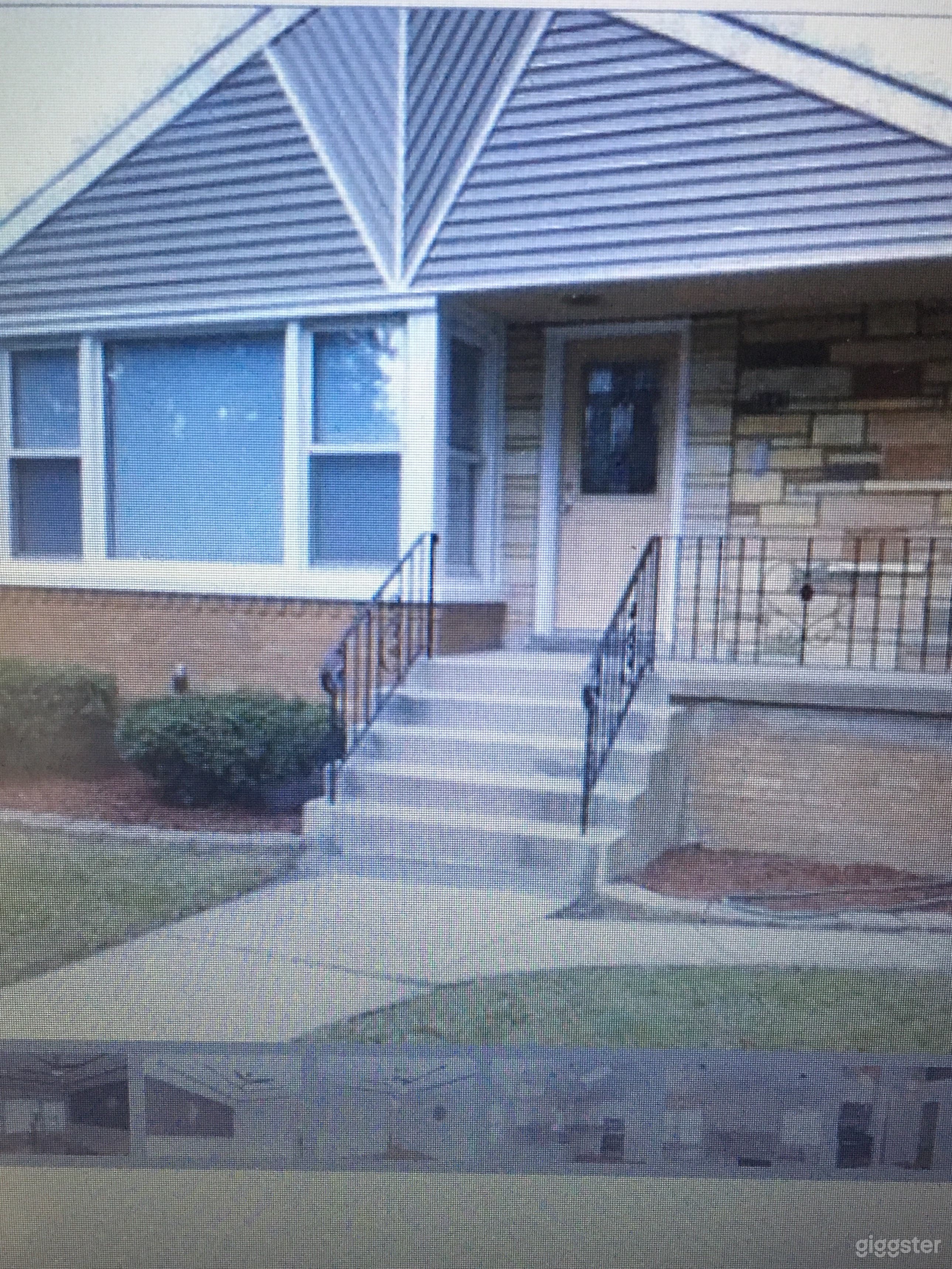 Brick raised ranch on tree lined block