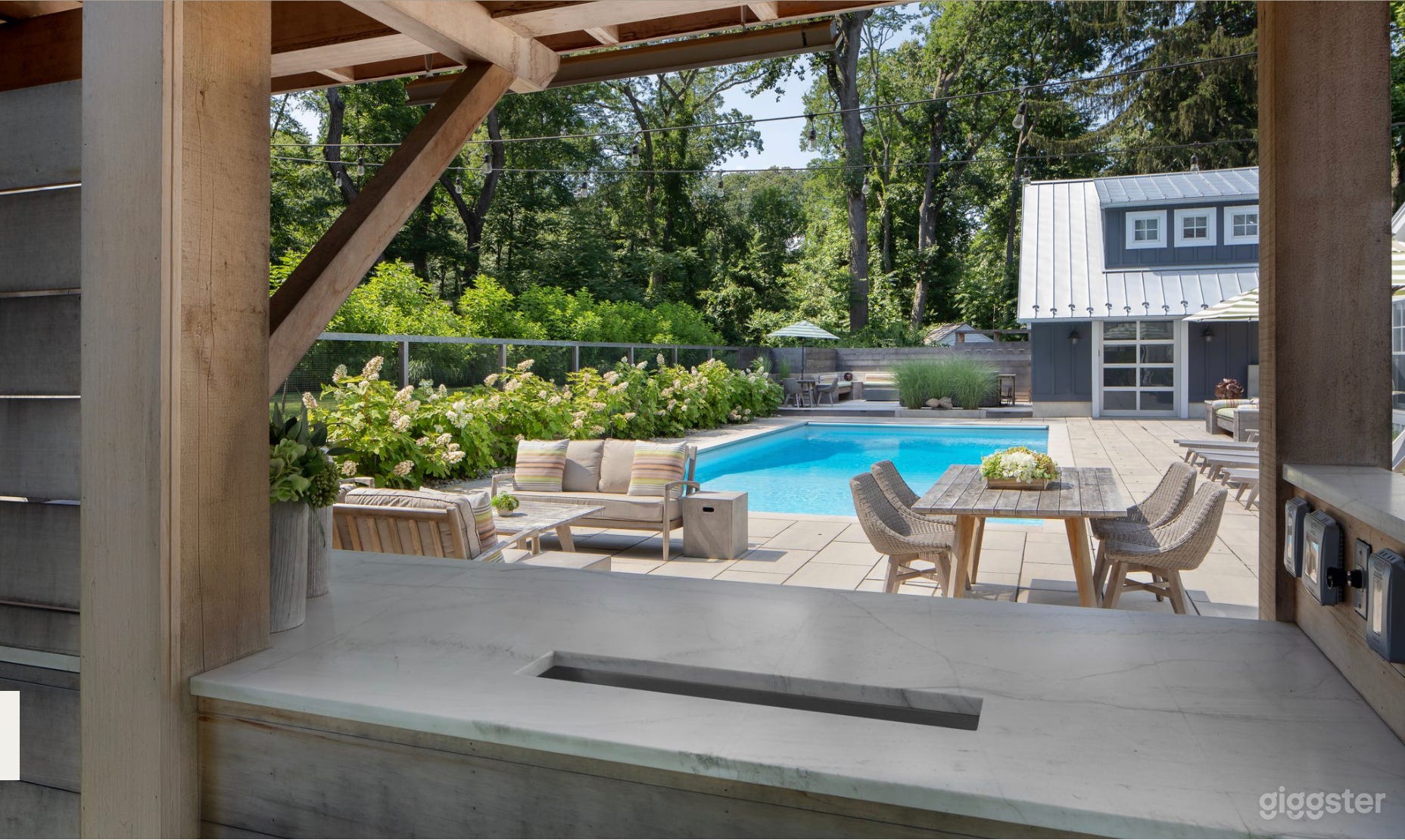 Pass thru window from turf court through to outdoor kitchen