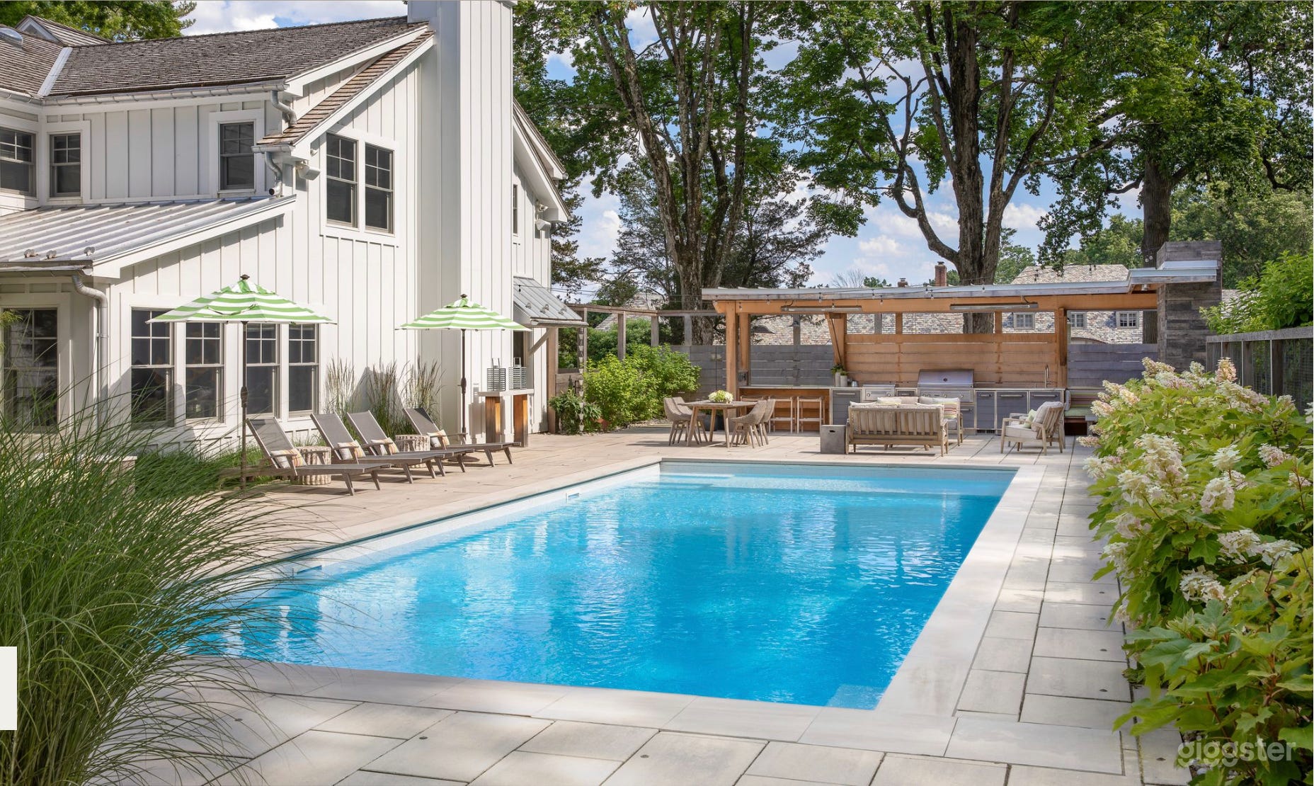 view from the Ipe deck across pool to outdoor kitchen area
