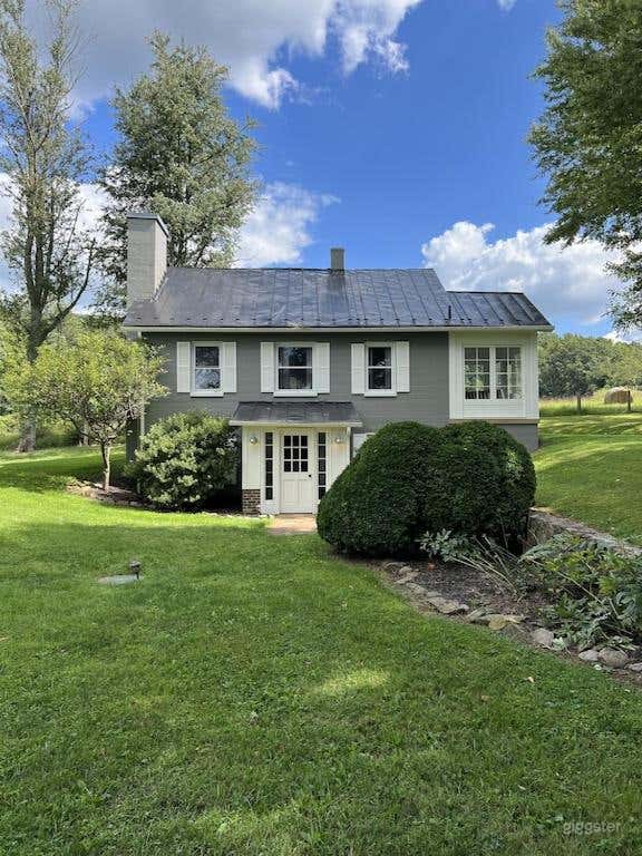 Front of the cottage with Upper Meadow and Mountains in the background