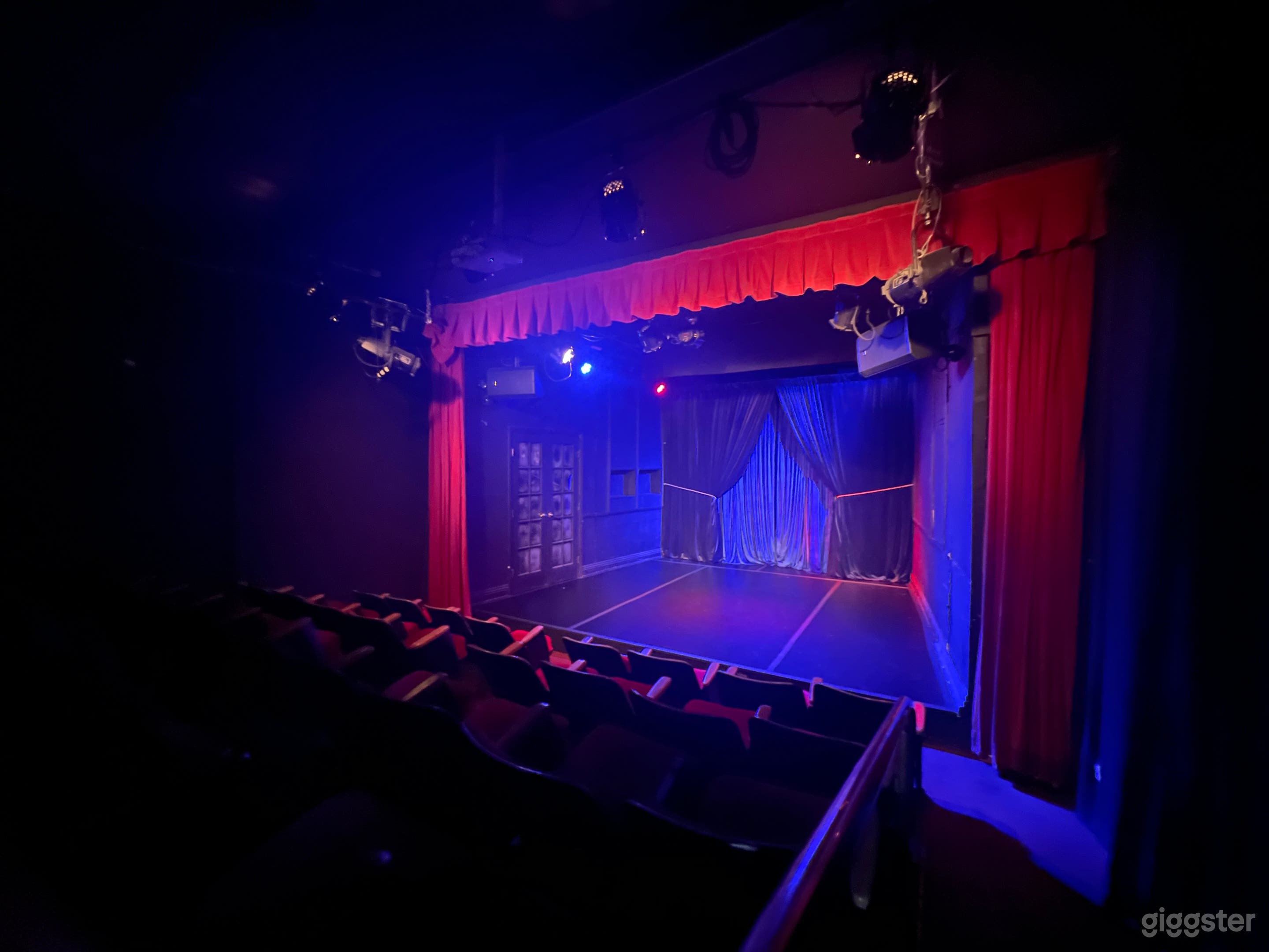 Intimate Red Seat Theater with Red Curtains Photo 1