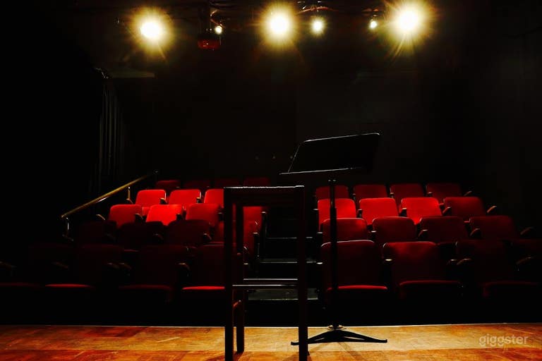  Intimate Red Seat Theater with Red Curtains 