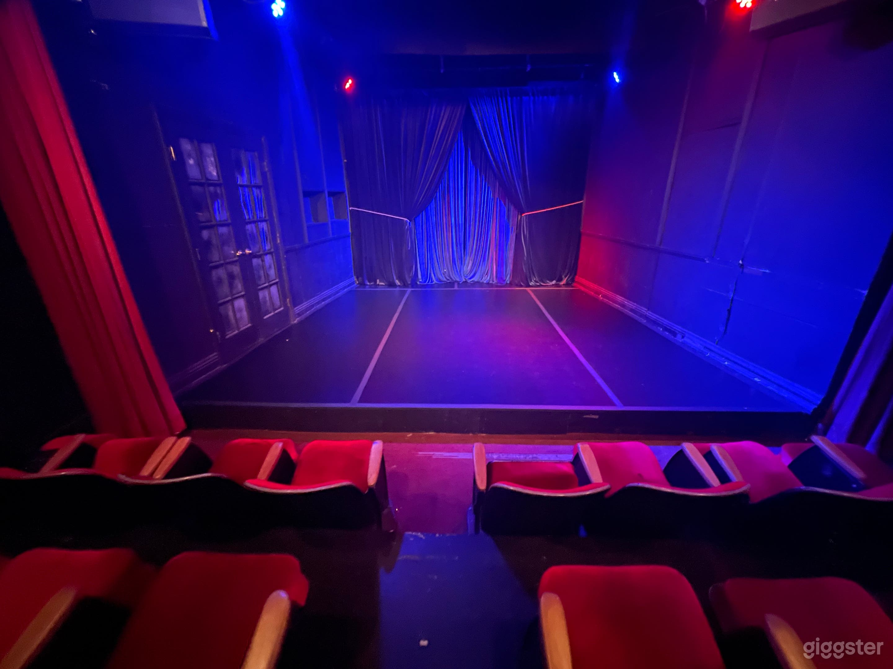 Intimate Red Seat Theater with Red Curtains Photo 3