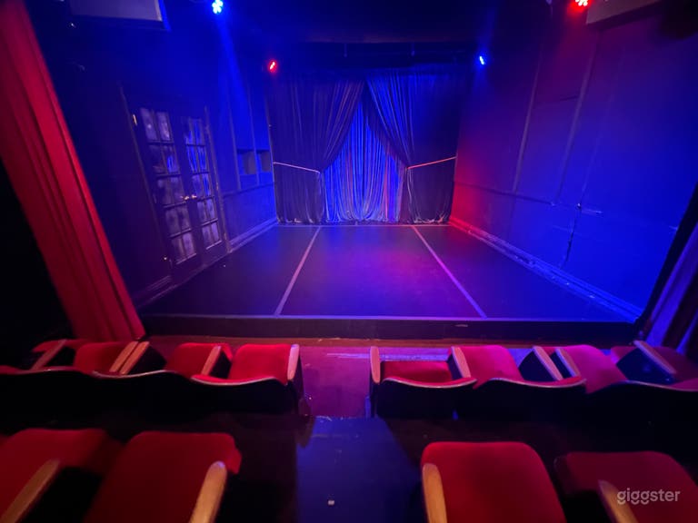  Intimate Red Seat Theater with Red Curtains 