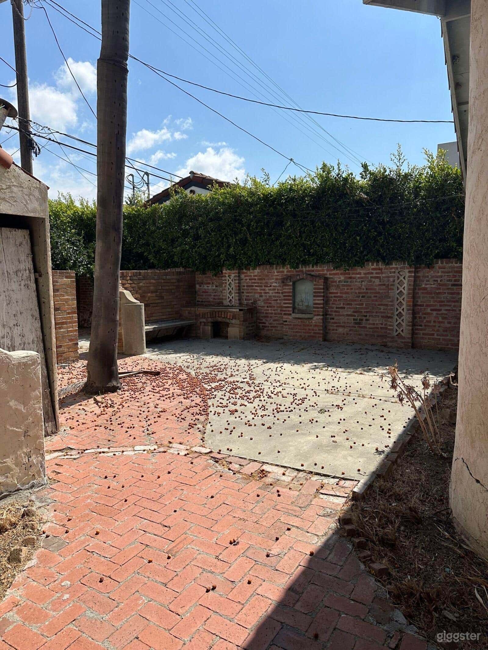 1920s Spanish-Style Fixer – Film-Ready Backyard Photo 1