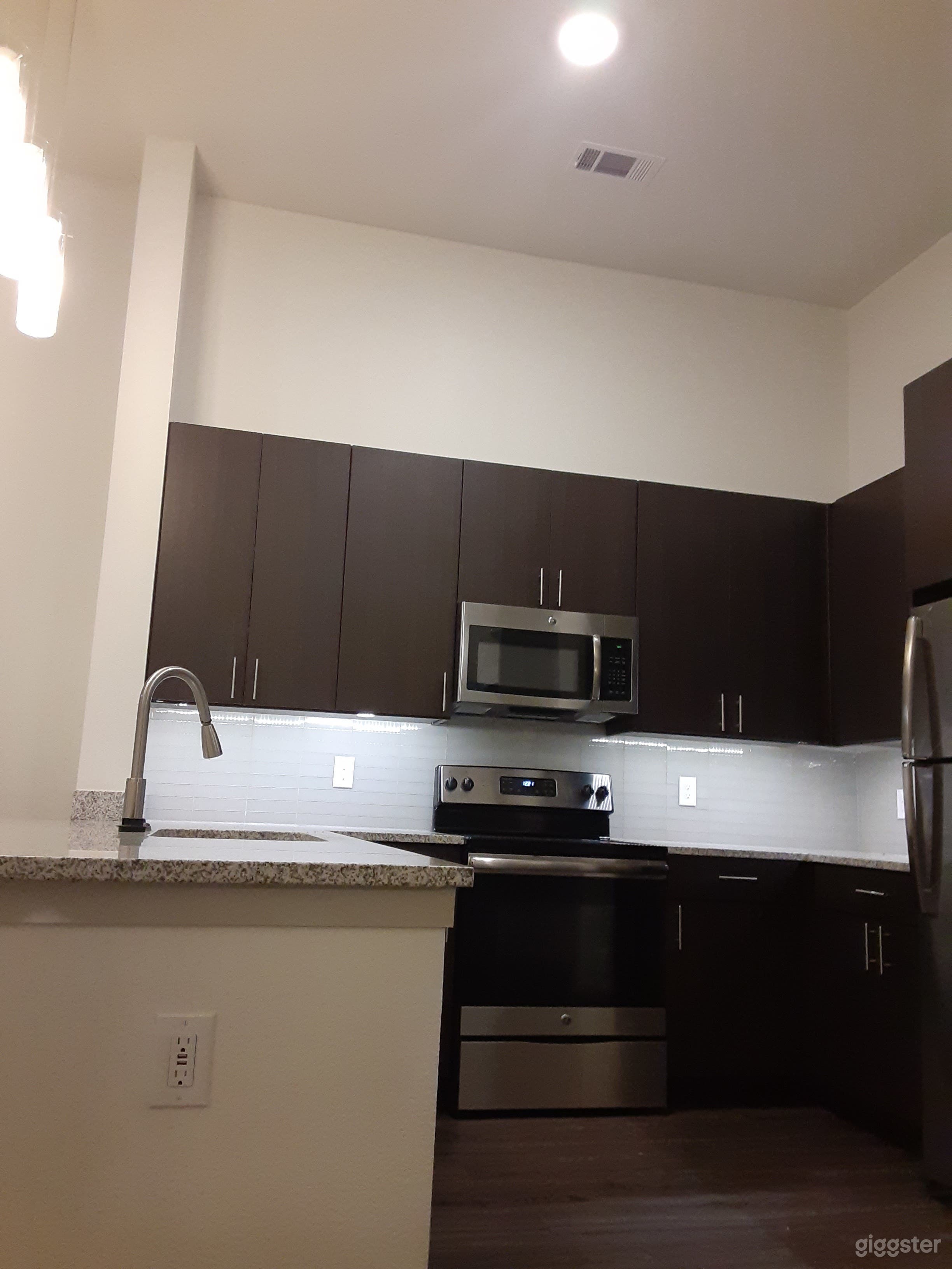 This is another view of the kitchen at a different angle', with a lot of cooking space' as you can see...