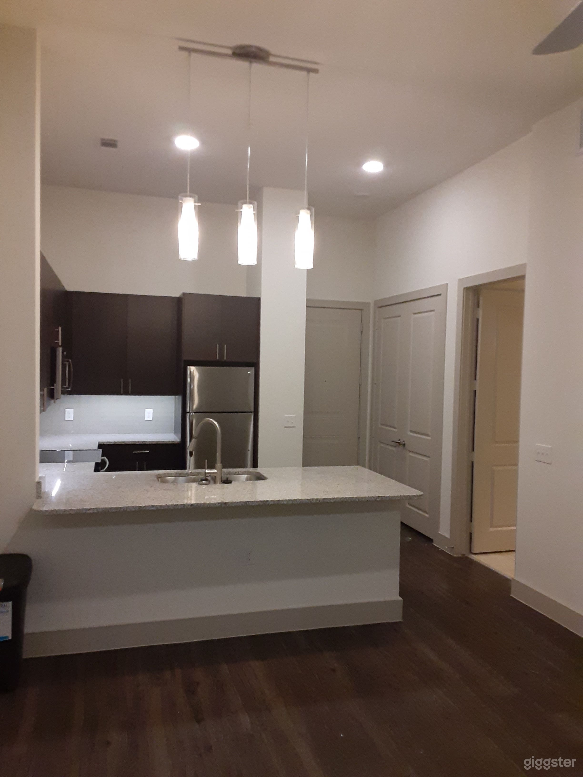 This is the entrance from the living room at the kitchen, the granite is beautiful isn't it...

GE Washer &amp; Dryer are in the double door laundry room.