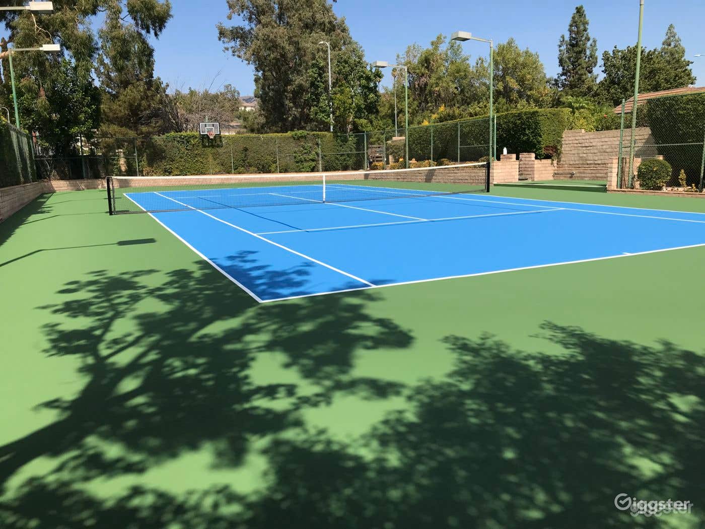 Half court basketball on tennis/pickle ball court Photo 1
