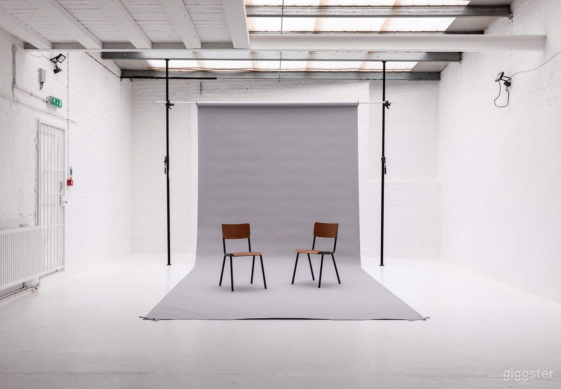 Bright White-Brick Warehouse Studio with Industrial Kitchen &amp; Backdrops Photo 4