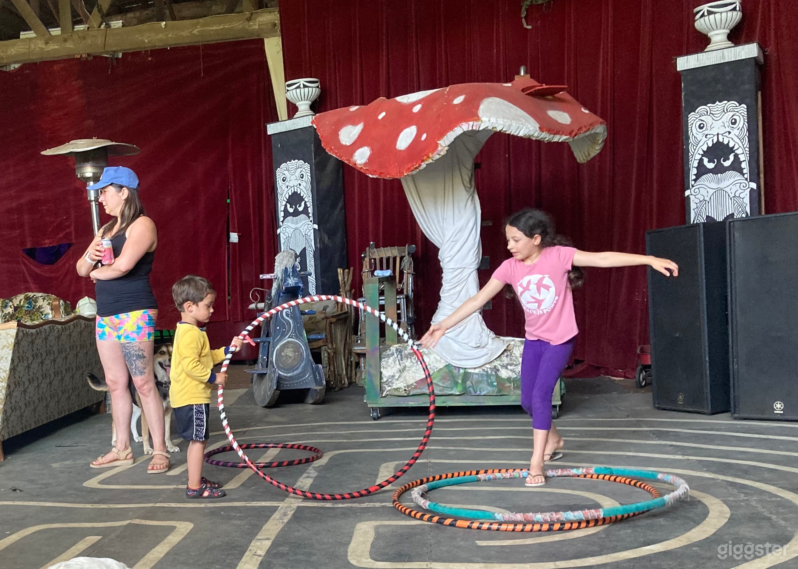 Happy playing inside the barn on the. Labyrinth dance floor and big mushroom that can be sat on. Rocking horses, hula hoops, tables&amp;chairs, antique couches, stage w/mirrors, all in the same area of the barn.