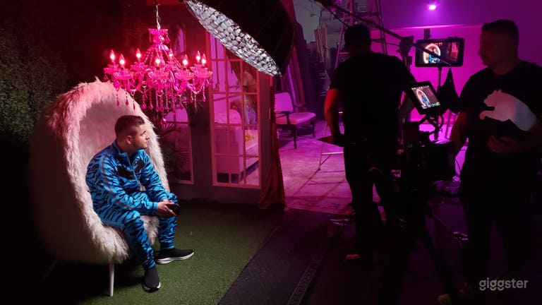  White faux fur chair &amp; Grass wall. 