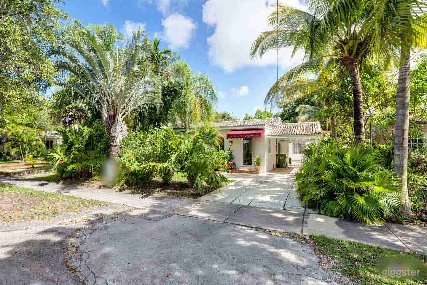 1920s Spanish Style Home in Tropical Foliage Photo 1