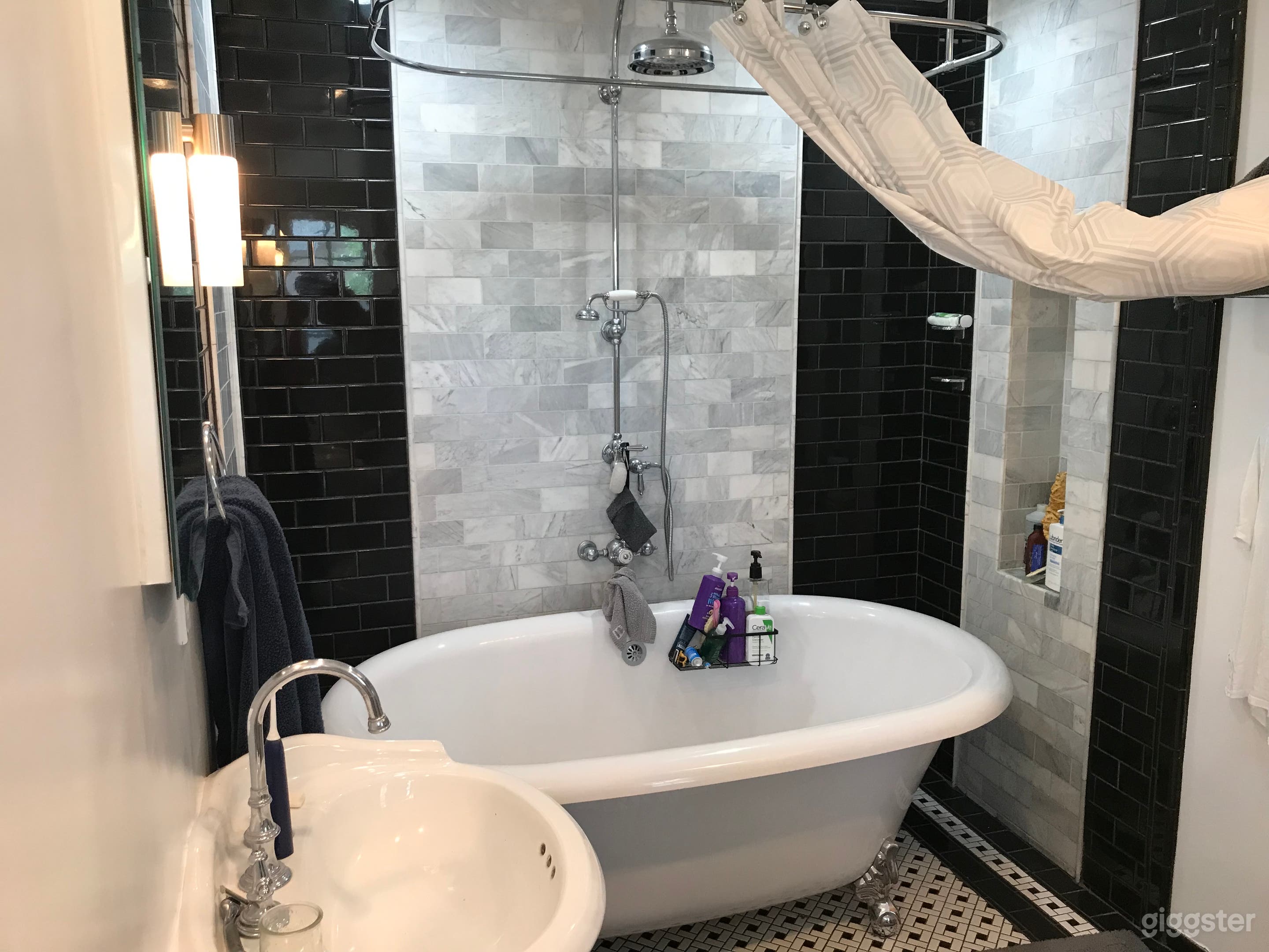 You’ve likely never seen a bigger claw foot tub. Double pedestal Sinks too. Tile bathroom