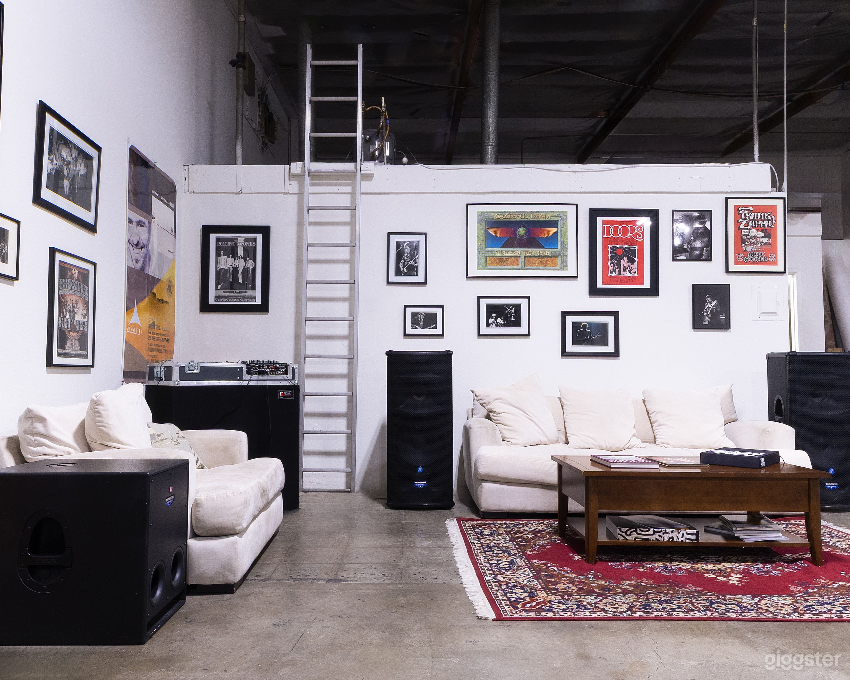 Comfortable lounge area with full-size speakers and sound system